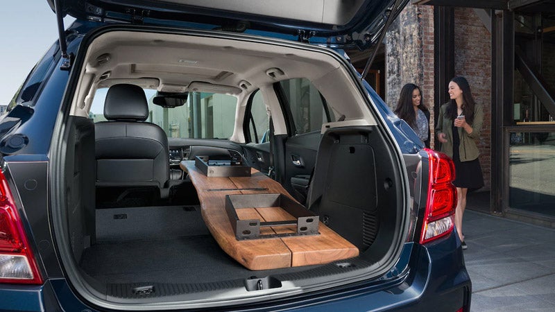 Chevrolet Trax showcasing its spacious interior and cargo area with a flat loading floor.