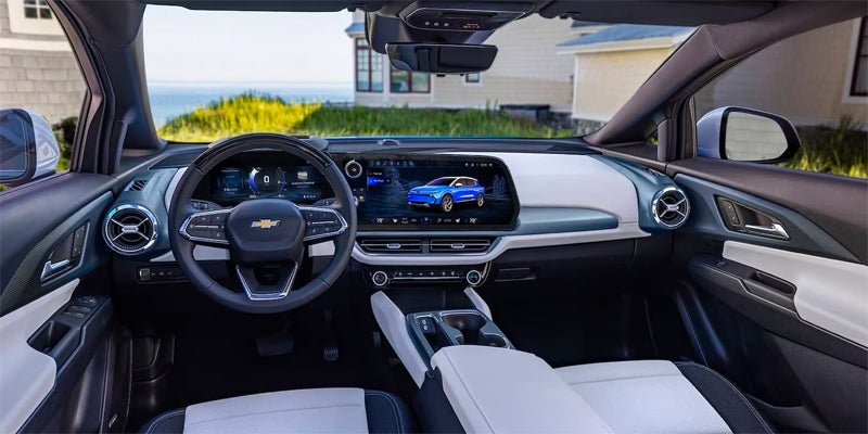 An interior shot of a Chevrolet Equinox EV steering wheel and console