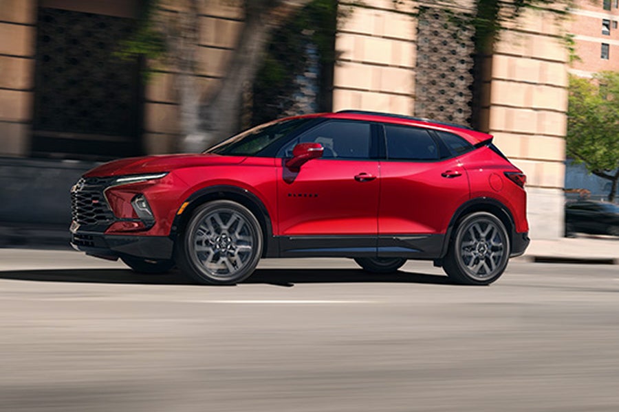 Woman sitting in a car, holding cash and car keys