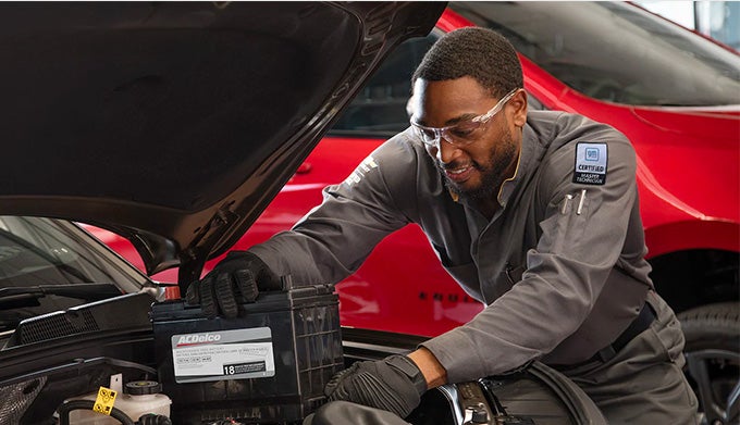 Technician putting in battery